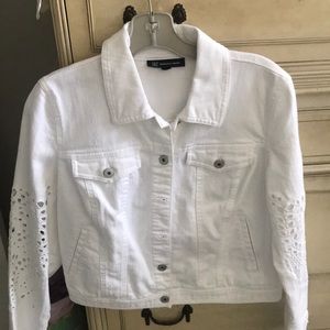 White jean short jacket with eyelet on sleeves and back.